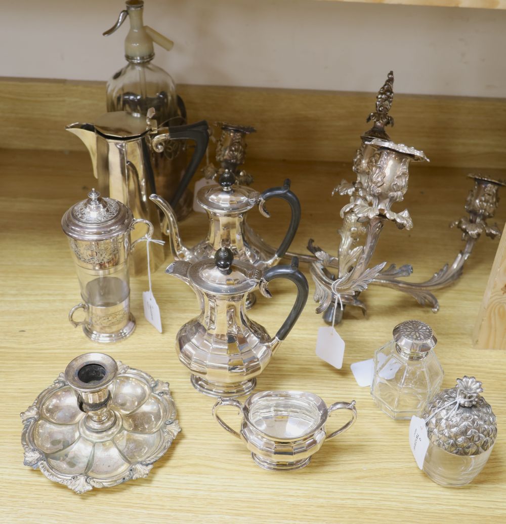 An ornate three-branch plated candelabrum with tulip sconces and sundry plated items,